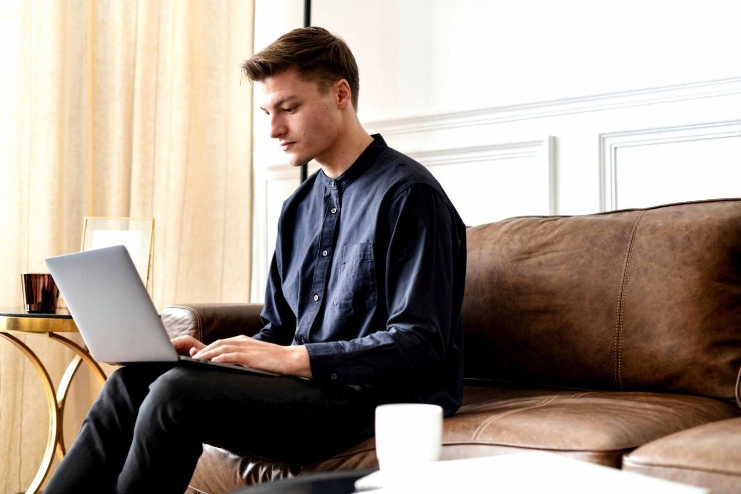 Professional using advanced budget software on multiple monitors